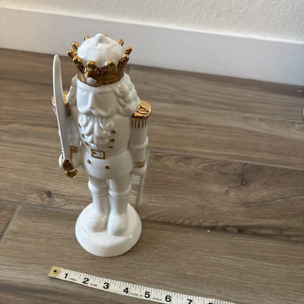 White Porcelain Nutcracker with Gold Trim Form The Holiday Aisle Figurine